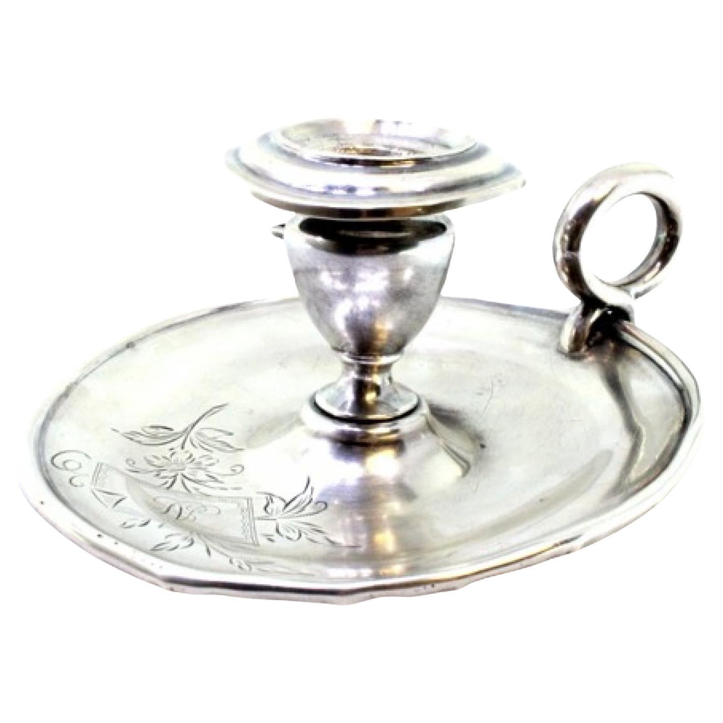 Silver paddle with engraved floral motifs