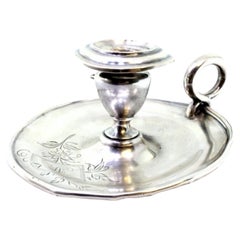 Silver paddle with engraved floral motifs