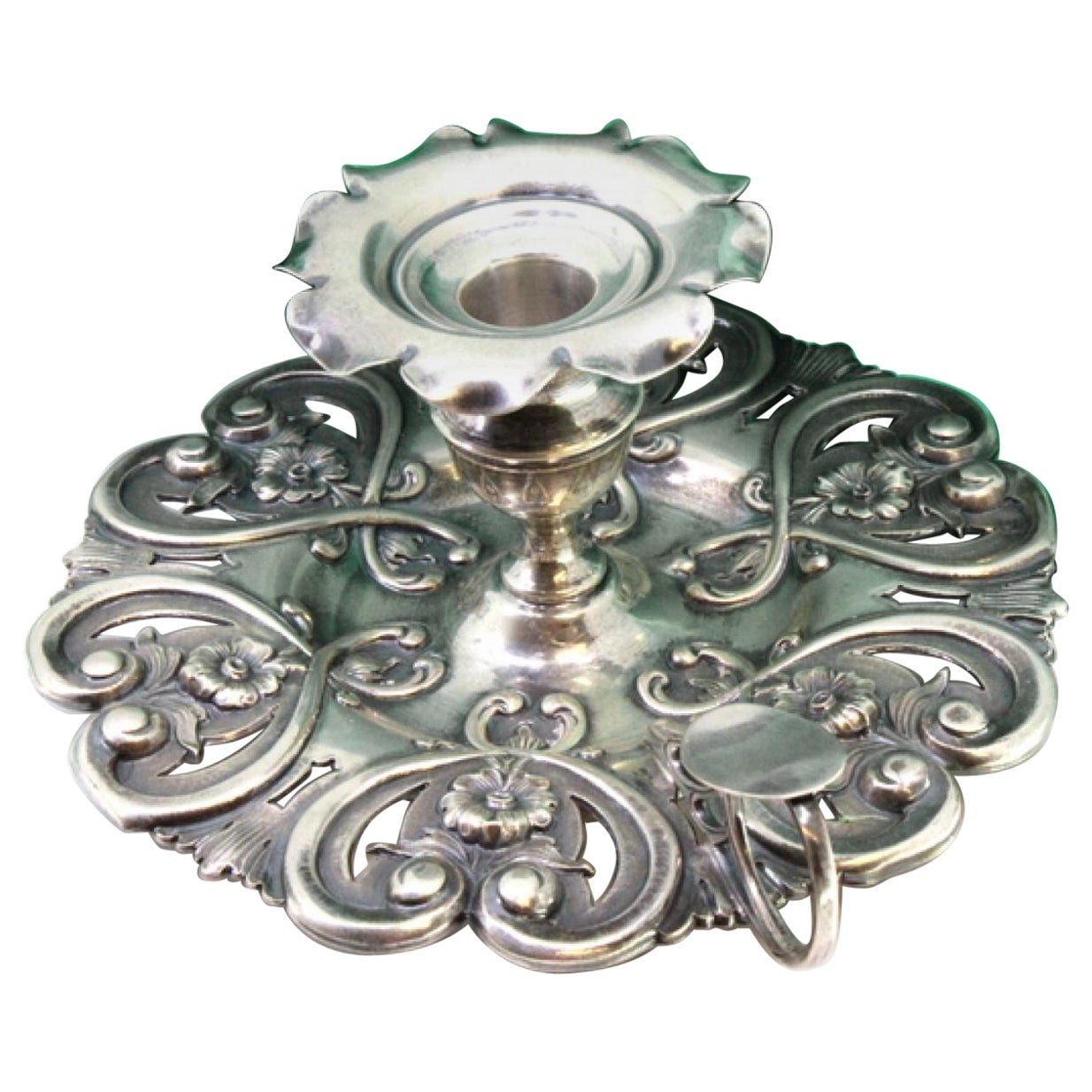 Silver paddle with floral motifs and a smooth handle