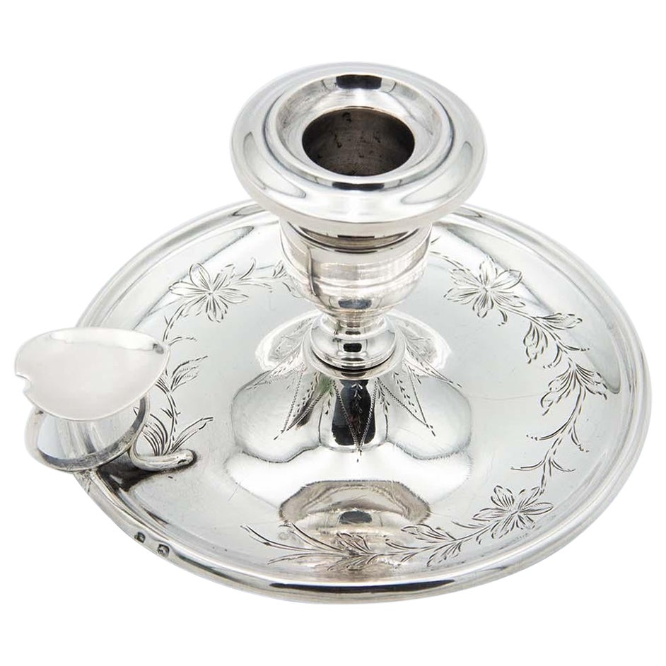 Silver paddle with floral motifs