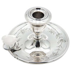 Silver paddle with floral motifs