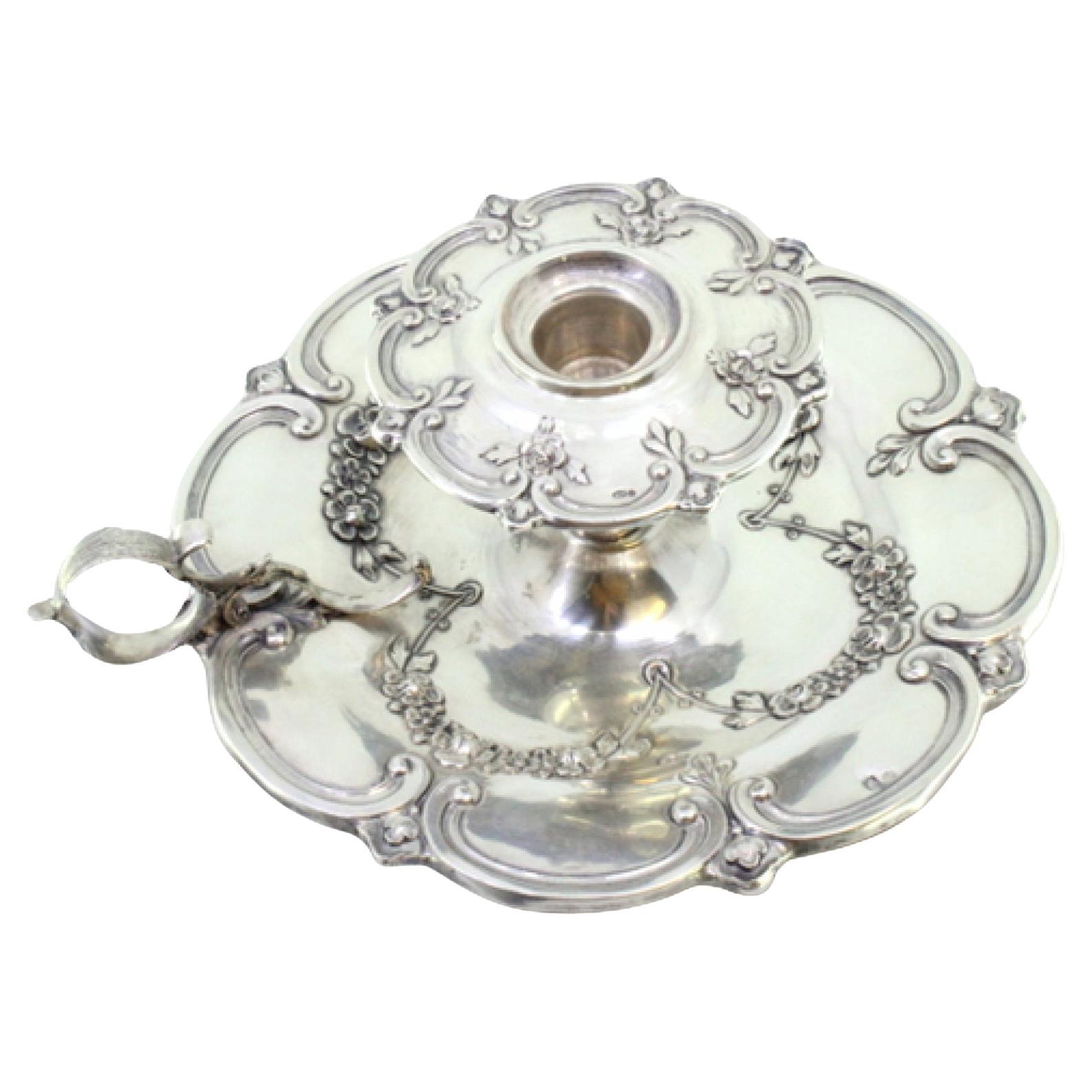 Silver paddle with floral motifs revealed