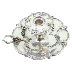 Silver paddle with floral motifs revealed