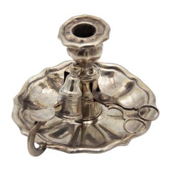 Silver paddle with morrón scissors and eraser