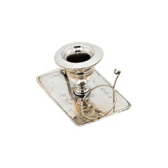 Silver paddle with raised florals, monogram card, and pocket watch holder