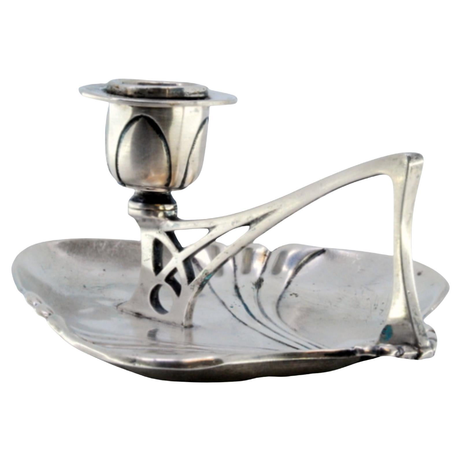 Silver paddle with relief in the center and a cut-out handle