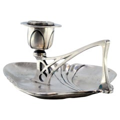 Silver paddle with relief in the center and a cut-out handle