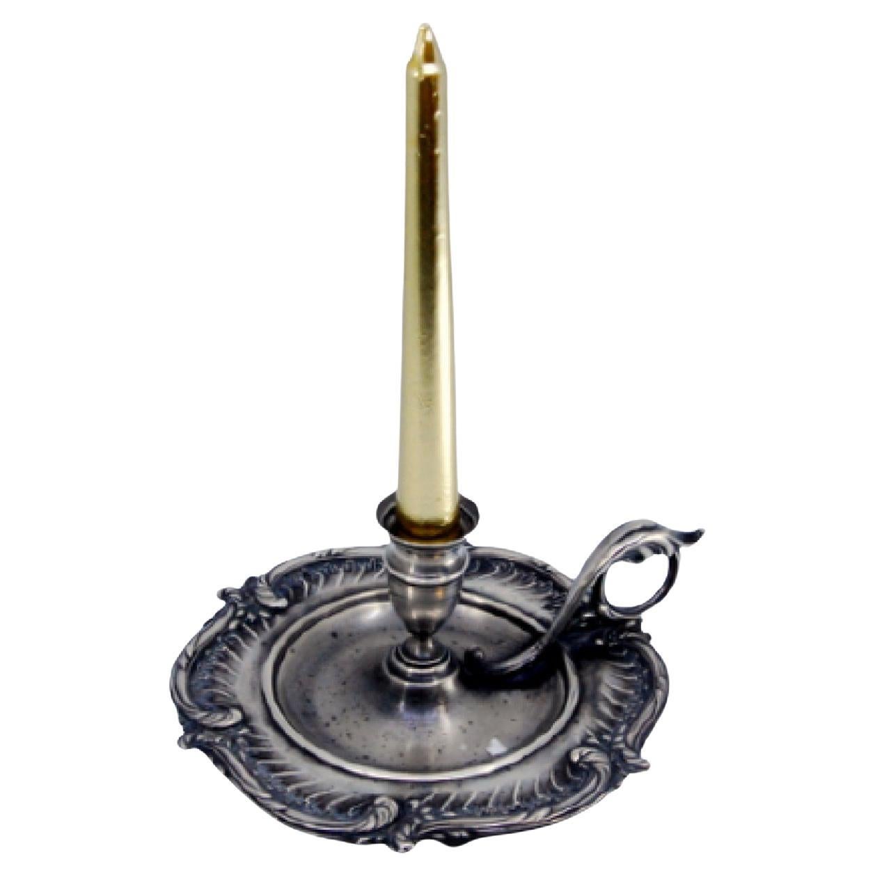 Silver paddle with reliefs and applications on the handle