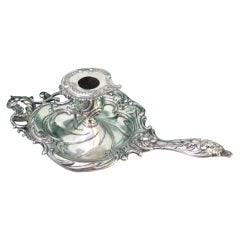 Silver paddle with reliefs, applications and cutouts