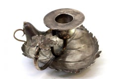 Silver paddle with reliefs, flame arrester, and leaf-shaped cutout base