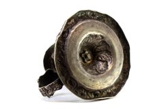 Silver paddle with revealed floral motifs, with monogram insert on the handle