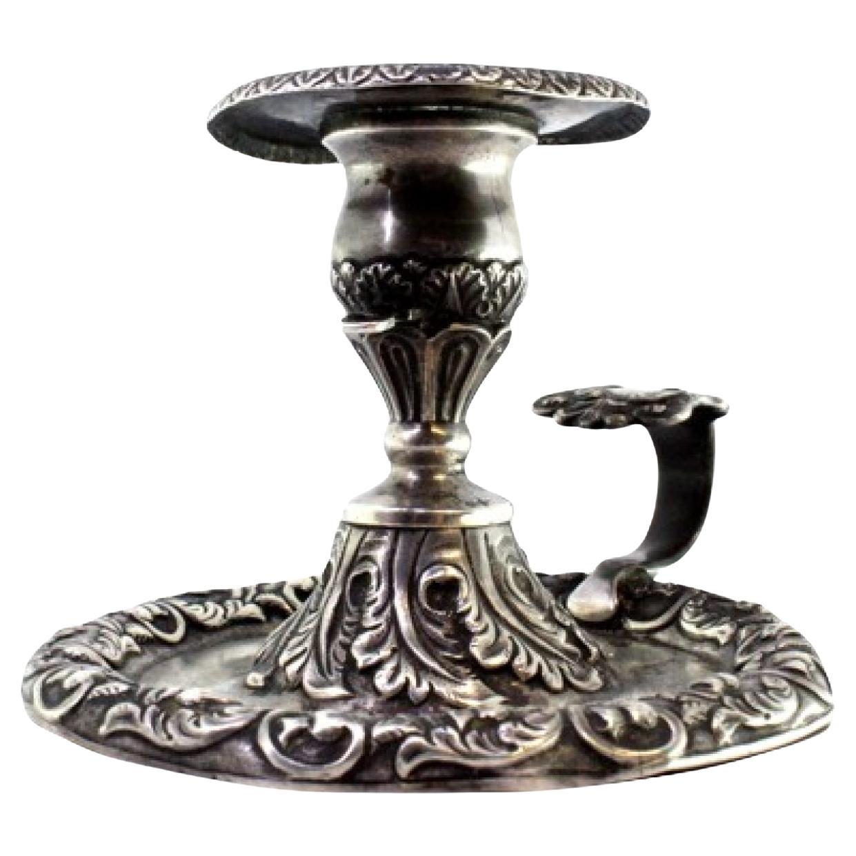 Silver paddle with revealed floral motifs, with monogram insert on the handle For Sale