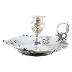 Silver paddle with shell-shaped and cut-out reliefs