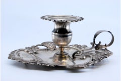 Silver paddle with shells and floral motifs