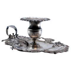 Silver paddle with shells and floral motifs