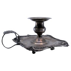 Silver paddle with smooth base and embossed rim