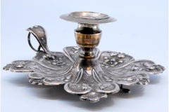 Silver paddle with smooth support and raised base