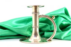 Silver paddle with two raised strips, smooth handle and circular base