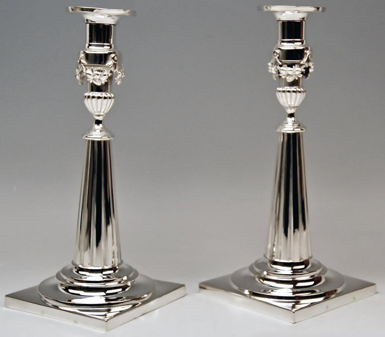 Gorgeous pair of candlesticks / period of classizism.

Made in Augsburg (circa 1800)
Master: Johann Rudolf Haller (1757 - 1844) 
The silversmith received licence of manufacturing in year 1785.
(Documentary Evidence: 'Verzeichniß der