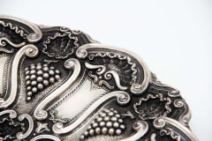 Silver parade salver with bunches of grapes and shells in relief