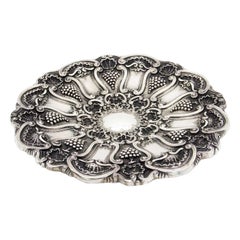 Silver parade salver with bunches of grapes and shells in relief