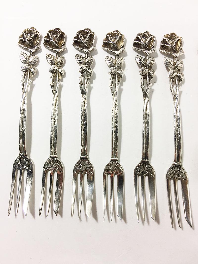 Silver pastry forks, teaspoons and a sugar scoop by Christoph Widmann, Germany

Model 