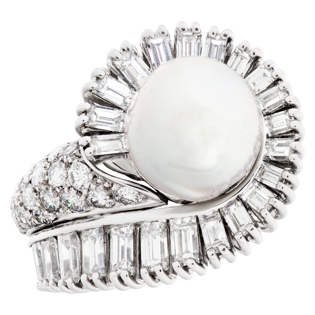 ESTIMATED RETAIL $7080.00 - YOUR PRICE $4,080.00 - Silver pearl ring set in platinum with approximately 2 carats in dancing round and baguette diamonds surrounding a 10mm pearl. This Pearl/diamond ring is currently size 4.5 and some items can be