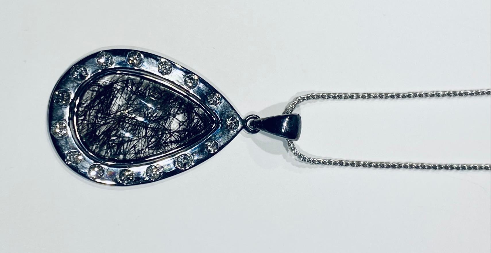 A Darkened Silver Pendant set with Diamonds,  around a Grafetite Quartz Cabochon For Sale 7