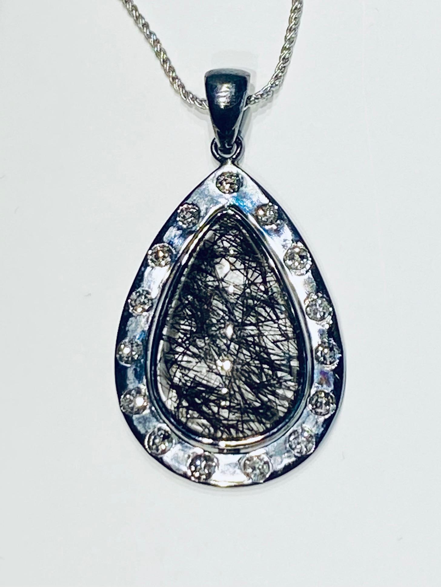 Contemporary A Darkened Silver Pendant set with Diamonds,  around a Grafetite Quartz Cabochon For Sale