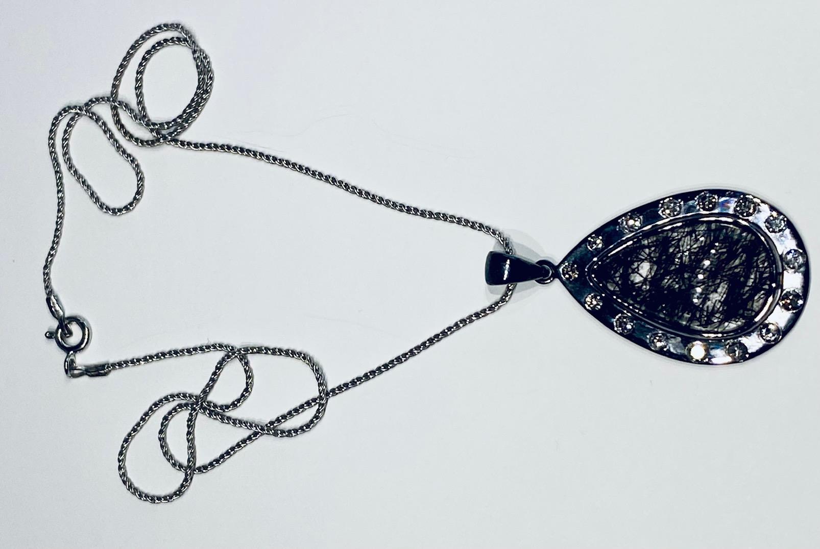Women's or Men's A Darkened Silver Pendant set with Diamonds,  around a Grafetite Quartz Cabochon For Sale