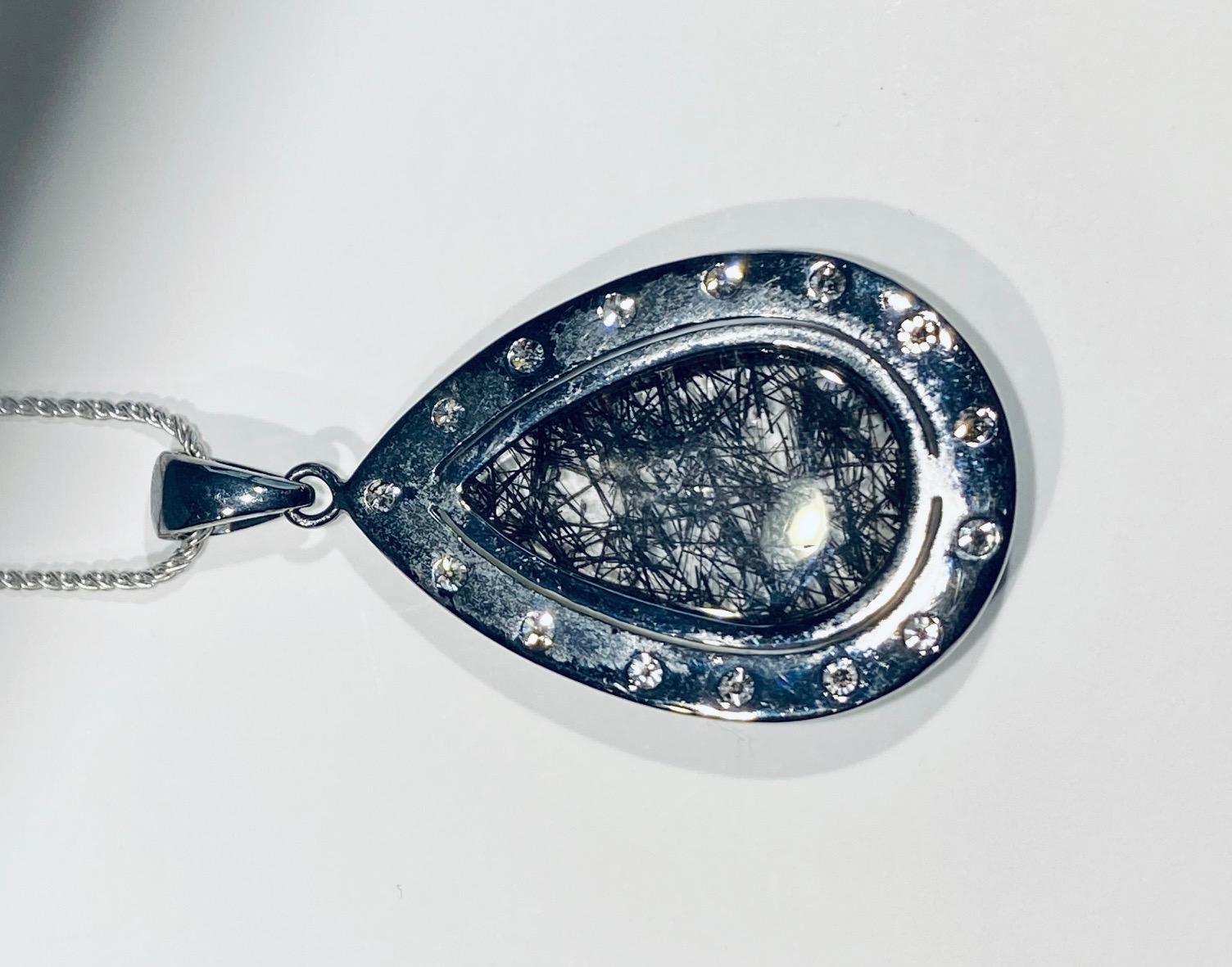A Darkened Silver Pendant set with Diamonds,  around a Grafetite Quartz Cabochon For Sale 2