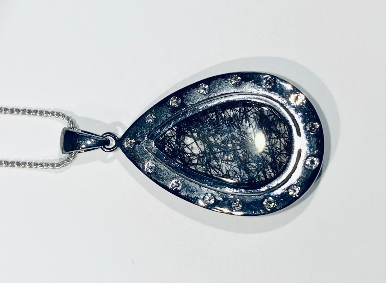 A Darkened Silver Pendant set with Diamonds,  around a Grafetite Quartz Cabochon For Sale 3