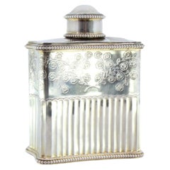 Silver perfume bottle with fluting, pearly friezes and engraved floral motifs