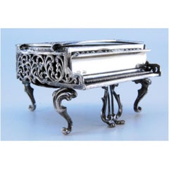 Silver piano-shaped music box