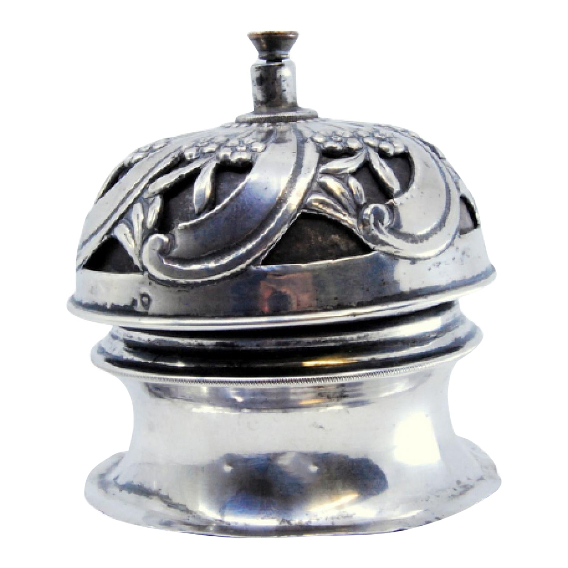 Silver pierced bell with spiral floral motifs and interior mechanism