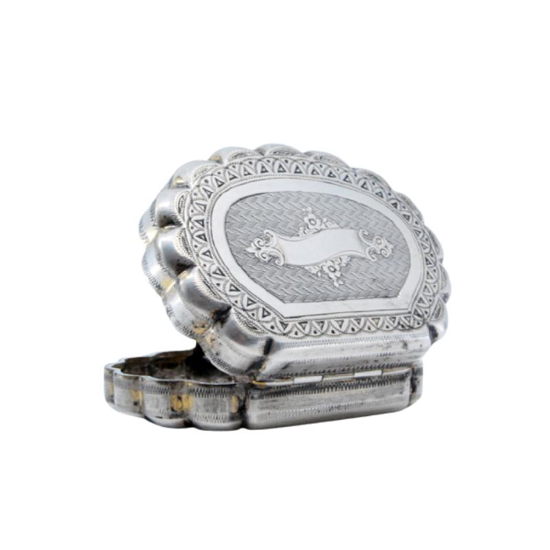 Silver pill box in guilloche shell shape with monogrammed blister and hinged lid