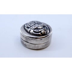 Silver pill box with African motifs on the removable lid