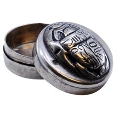 Silver pill box with African motifs on the removable lid