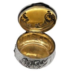 Silver pill box with antique lady figure in enamel on the hinged lid