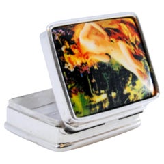 Silver pill box with enamel nude woman figure on the hinged lid