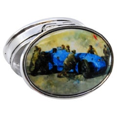 Silver pill box with enamel racing car image on the hinged lid