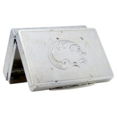 Silver pill box with engravings and trim on the hinged lid