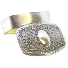 Silver pill box with floral embossing, monogram and gold interior