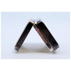 Silver pill box with fluted edges along the hinged lid