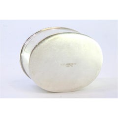 Silver pill box with pearl trim and lid with oval-shaped green stone