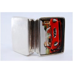 Silver pill box with racing car enamel on the hinged lid