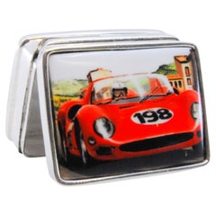 Silver pill box with racing car enamel on the hinged lid