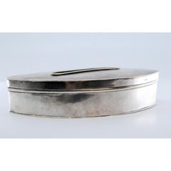 Silver pin box with raised pin design on the lid