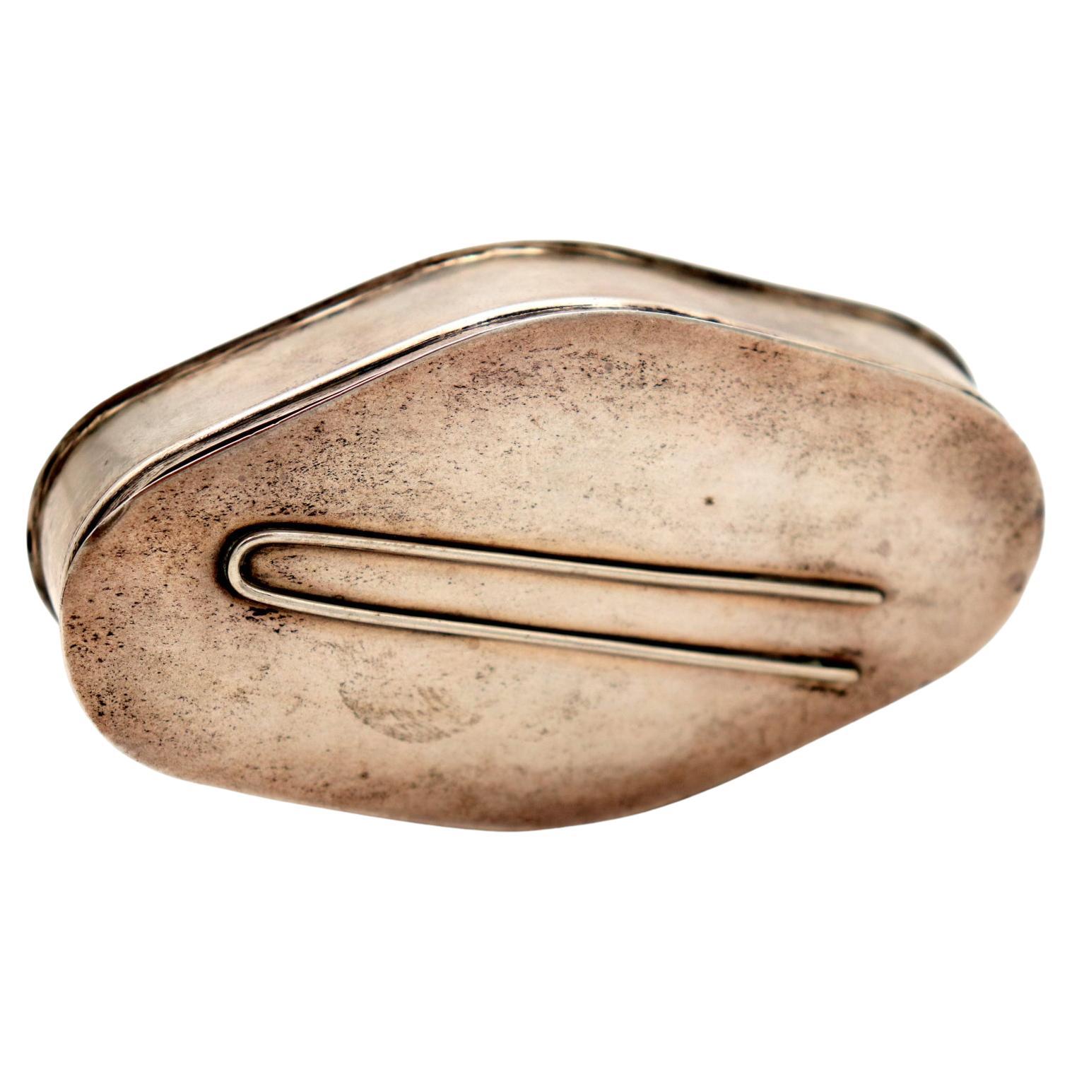 Silver pin box with reliefs on the lid