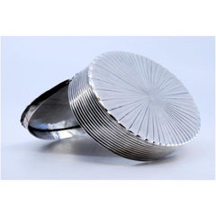 Silver pin box with vortex-shaped reliefs